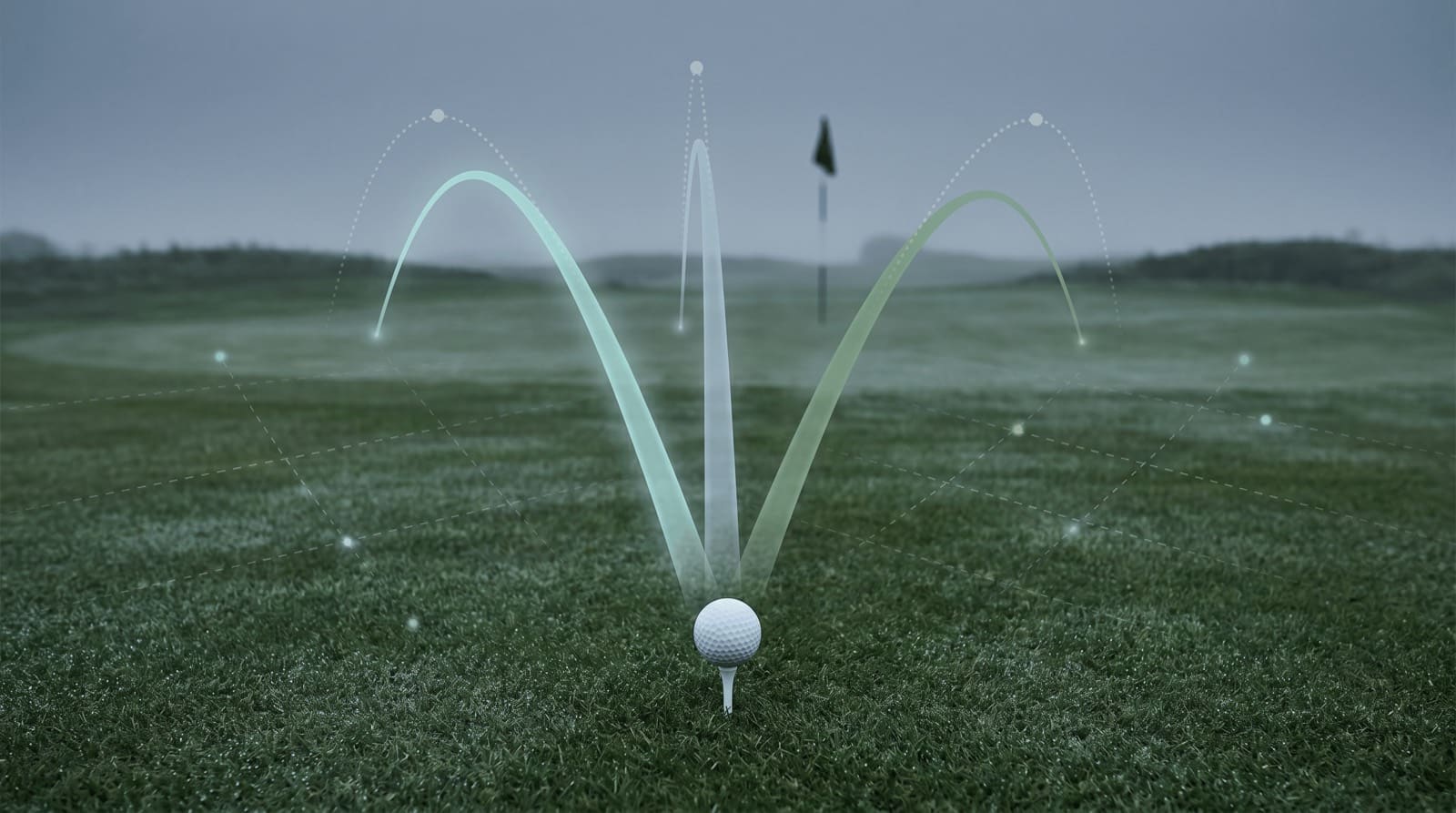 Three golf-ball trajectories rising from a teed ball and curving to different finishes, one drawing left, one straight, one fading right, over a fairway toward a distant flag, illustrating how the clubface and path shape ball flight.